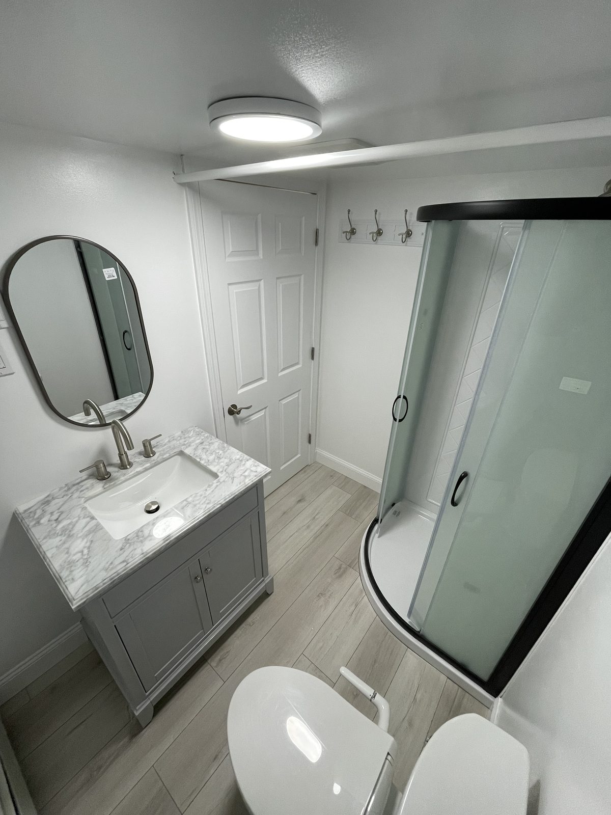 Finished basement bathroom with glass shower