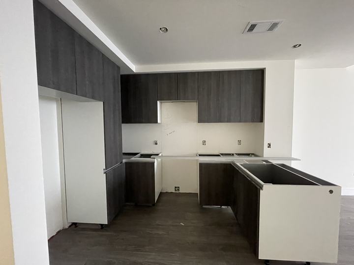 Modern condo kitchen renovation with dark cabinets