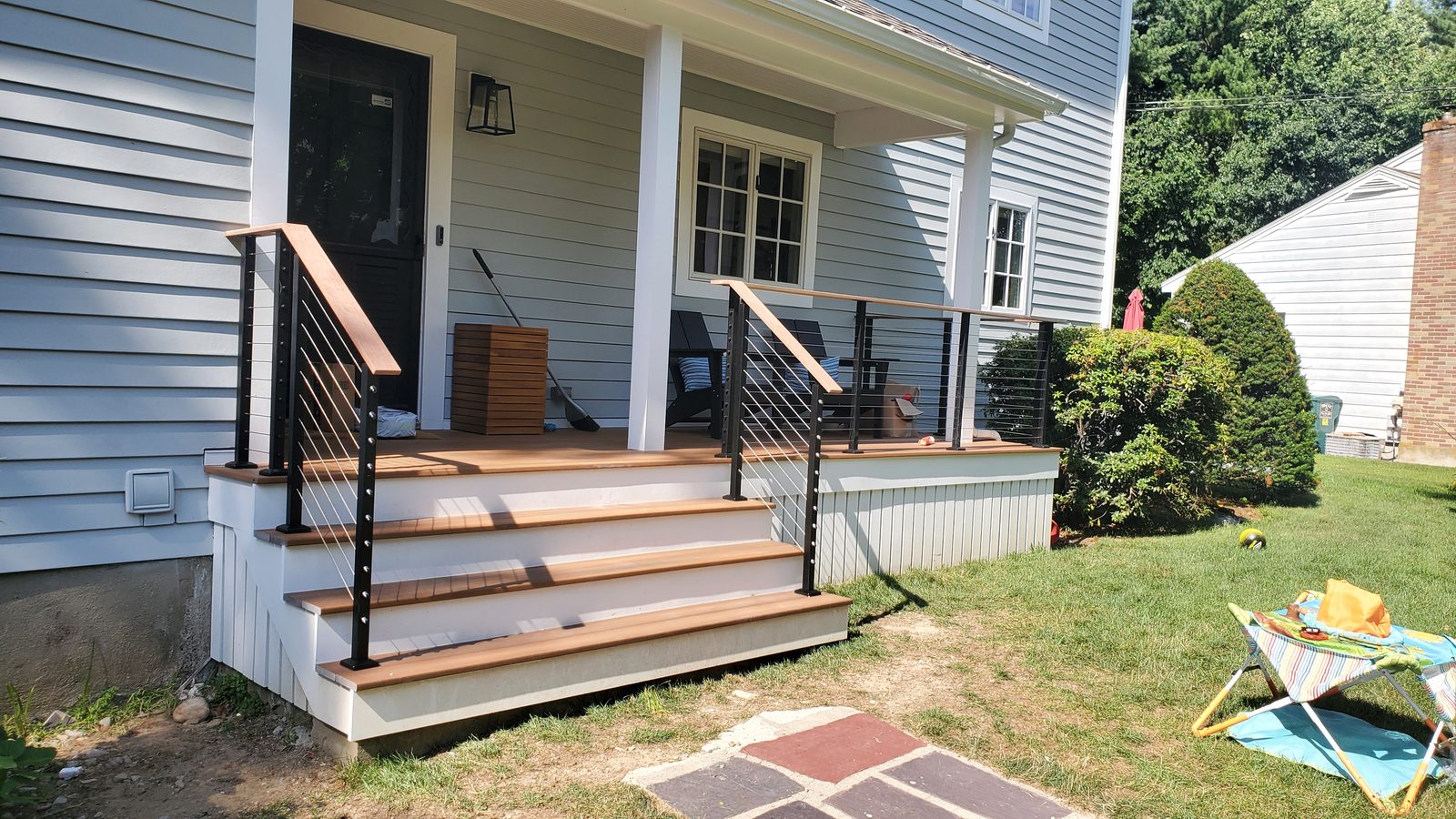 Front steps and walkway of a renovated home that must be kept clear of snow