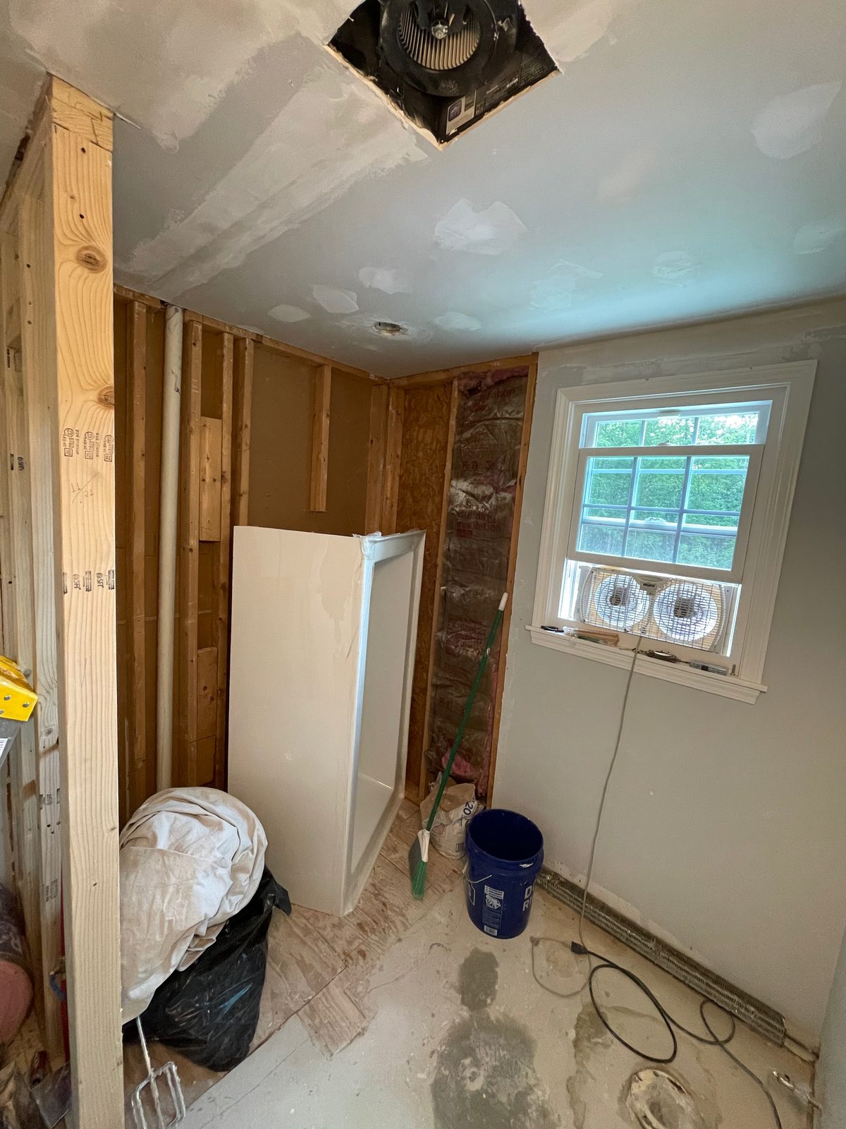 Bathroom opened up to the studs before a permitted remodel