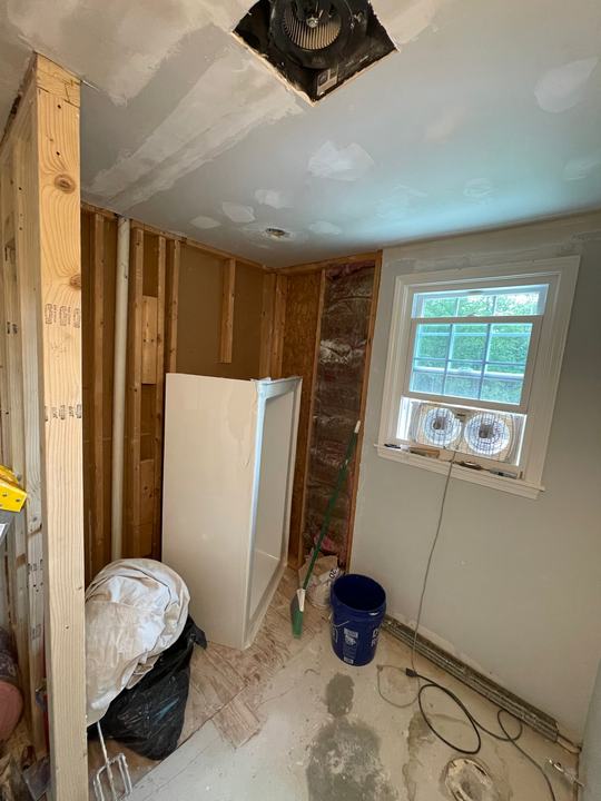 Bathroom opened up to the studs before a permitted remodel